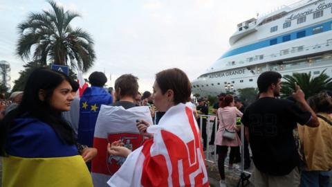 Demonstrators protest against the arrival of the Astoria Grande cruise ship, with some 800 mostly Russian passengers on board, Batumi, Georgia.