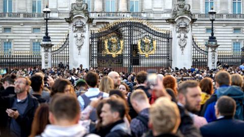 The public gather outside Buckingham Palace in London, on 8 September 2022, in London, England