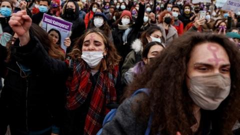 Activists participate in a protest against Turkey's withdrawal from Istanbul Convention