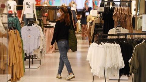 Shopper wears face mask