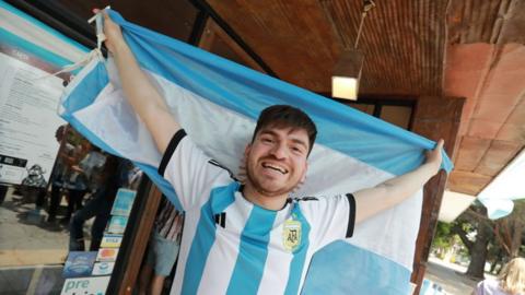 An Argentina football fan celebrates in El Calafate, Argentina