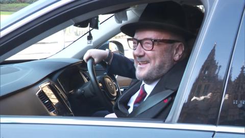 George Galloway arrives in a Volvo at Westminster's Carriage Gates