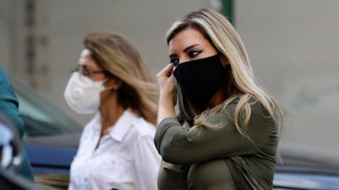 Women wearing face masks walk along a street in Beirut, Lebanon (2 November 2020)