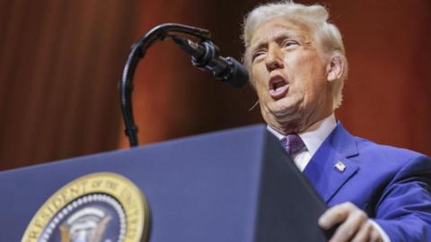 US President Donal Trump Addresses Republican Governors Association Meeting in Washington DC on 20 Feb 2025. He is wearing a blue suit and speaking in front of a microphone