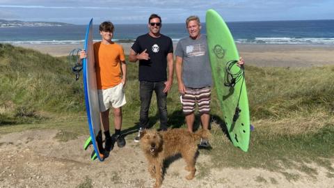 Nathan Phillips, with Theo and Luke Van Meter
