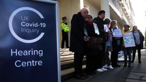 Protesters outside hearing centre