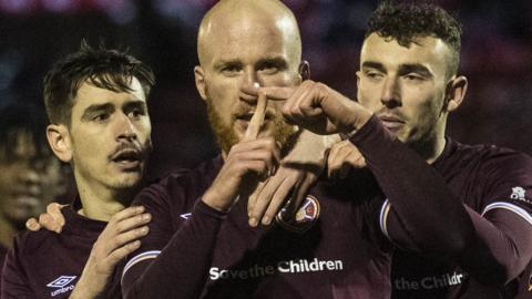 Hearts scorer Liam Boyce (centre) celebrates