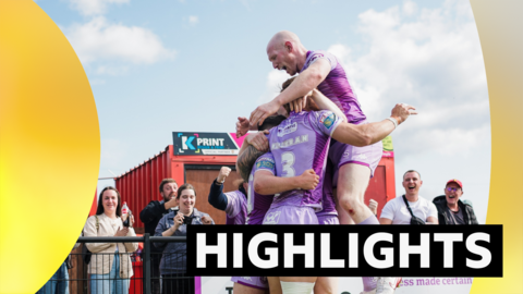 Wigan Warriors players celebrating a try