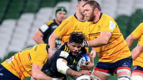 Jonathan Danty is tackled by Nick Timoney and Duane Vermeulen