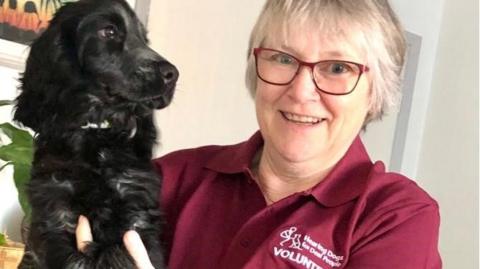 Volunteer Janice with her trainee hearing puppy called Elvis