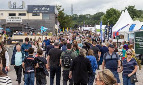 Hundreds of people are visible walking between stalls at the Bath and West Show