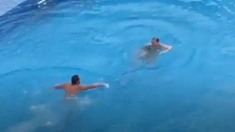 Video shows police removing councillor Joanne Rust from a swimming pool after she refused to leave.