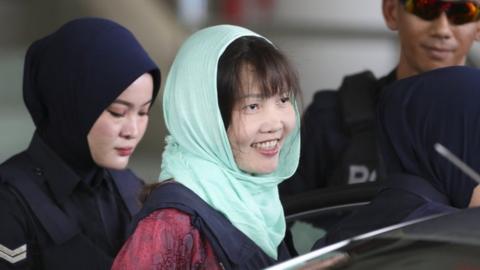 Vietnamese Doan Thi Huong smiles as she is escorted by Malaysian police at the Shah Alam High Court on 1 April, 2019