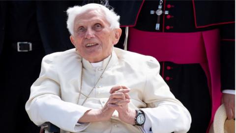 Pope Emeritus Benedict XVI gestures at the Munich Airport before his departure to Rome, June 22, 2020.