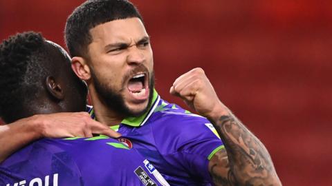 Nahki Wells celebrates scoring Bristol City's third goal at Middlesbrough