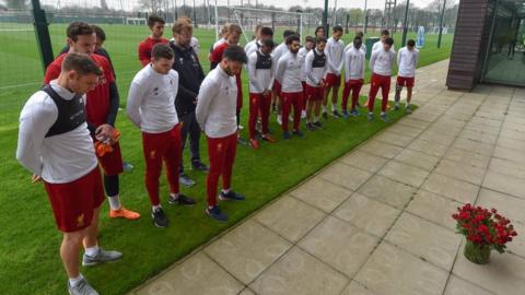 Liverpool FC players and manager hold silence