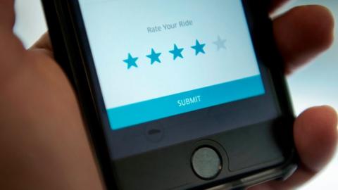 A mobile screen shows the Uber app asking a rider to rate their trip with a driver.