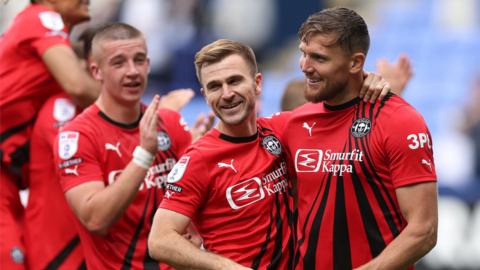 Charlie Wyke (right) celebrates with his team-mates at the end of Wigan's win over Bolton