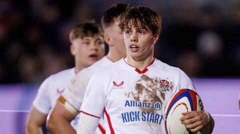 England's Lucas Friday holds a ball