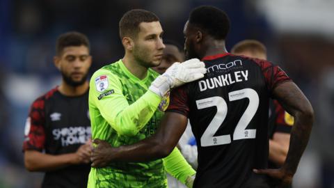 Shrewsbury Town players congratulating each other