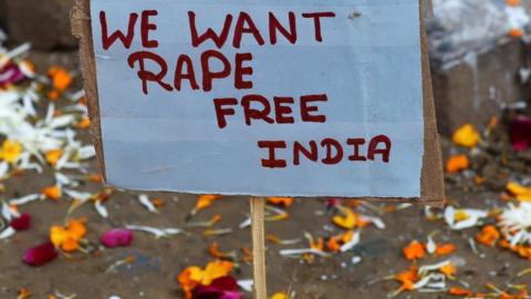 A placard calling for a rape-free India is pictured beside a memorial in Jantar Mantar, Delhi on December 16, 2014