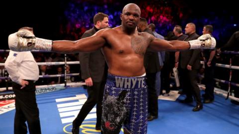 Dillian Whyte celebrates in the ring