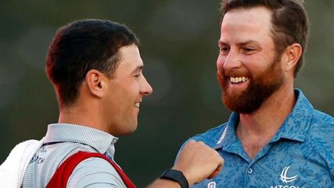 Chris Kirk and his caddie celebrate winning the Honda Classic