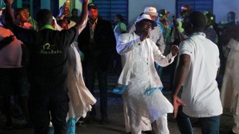 Supporters of Nigeria's President Muhammadu Buhari celebrate in Abuja