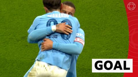 Bernardo Silva celebrates a goal with teammate Kyle Walker in the FA Cup quarter-finals.