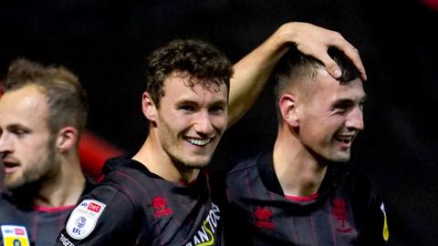 Lincoln City's Matty Virtue (centre) celebrates scoring their side's first goal of the game against Bristol City in the EFL Cup