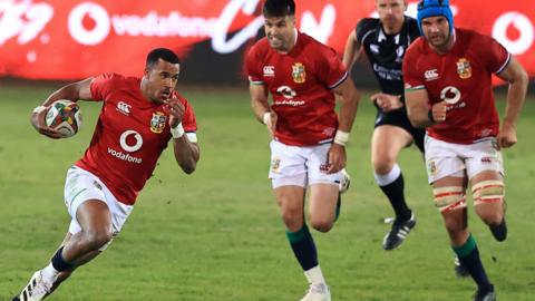 Anthony Watson runs with the ball for the Lions