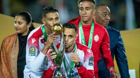 Wydad Casablanca players celebrate with the African Champions League trophy