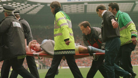 David Busst is carried off on a stretcher at Old Trafford during the match between Manchester United and Coventry City at Old Trafford
