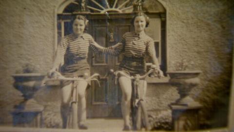 Twins on their bike