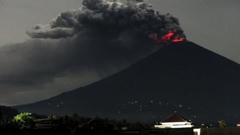 Smoke and ash rise from Mount Agung