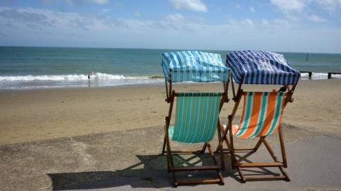 Two deckchairs on Sandown beach