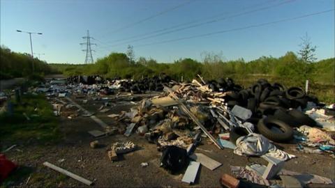 A Newport road filled with rubbish