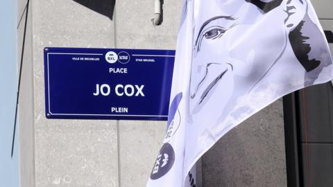 The name plate of Jo Cox square is unveiled during a ceremony to the name a square after her, in Brussels, Belgium, 27 September 2018