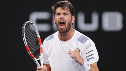 Cameron Norrie punches the air to celebrate