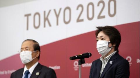 Tokyo 2020 Organising Committee CEO Toshiro Muto (L) and Tokyo 2020 Organising Committee President Seiko Hashimoto speak to media after video conference with IOC executive board, on 24 February 2021