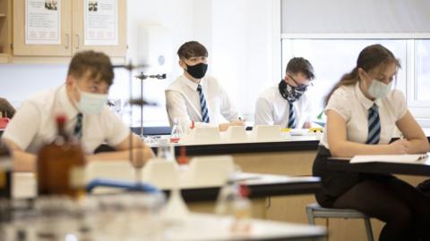 Secondary school pupils wearing masks in class