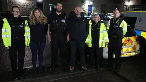 G999 team members from the police and charity standing in a row