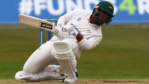 Rehan Ahmed ducks to avoid being hit by the ball as he bats