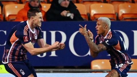 Chris Wood celebrates