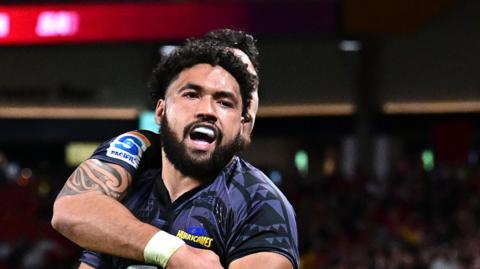 Fehi Fineanganofo celebrates for the Hurricanes