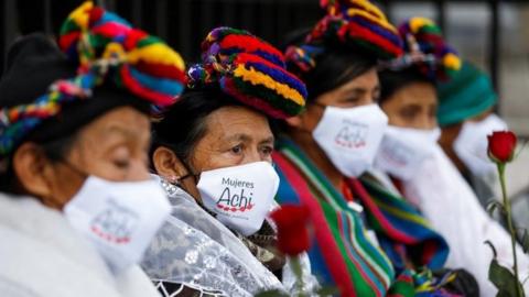 Women gather during the trial of five former Guatemalan paramilitaries charged with the rape of 36 women from the indigenous Achi group from 1981 to 1985