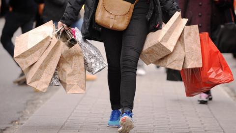 A person with shopping bags