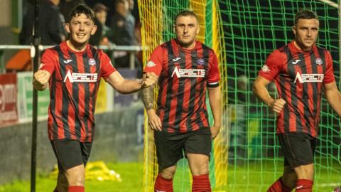 Porthmadog's Morgan Owen (left) celebrates after scoring his late goal against Caernarfon.