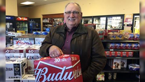 Gerard Comeau buying beer in Quebec after his 2016 court win