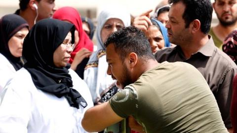 A relative of Tunisian migrants reacts as he leaves a hospital morgue in Sfax on 4 June 2018